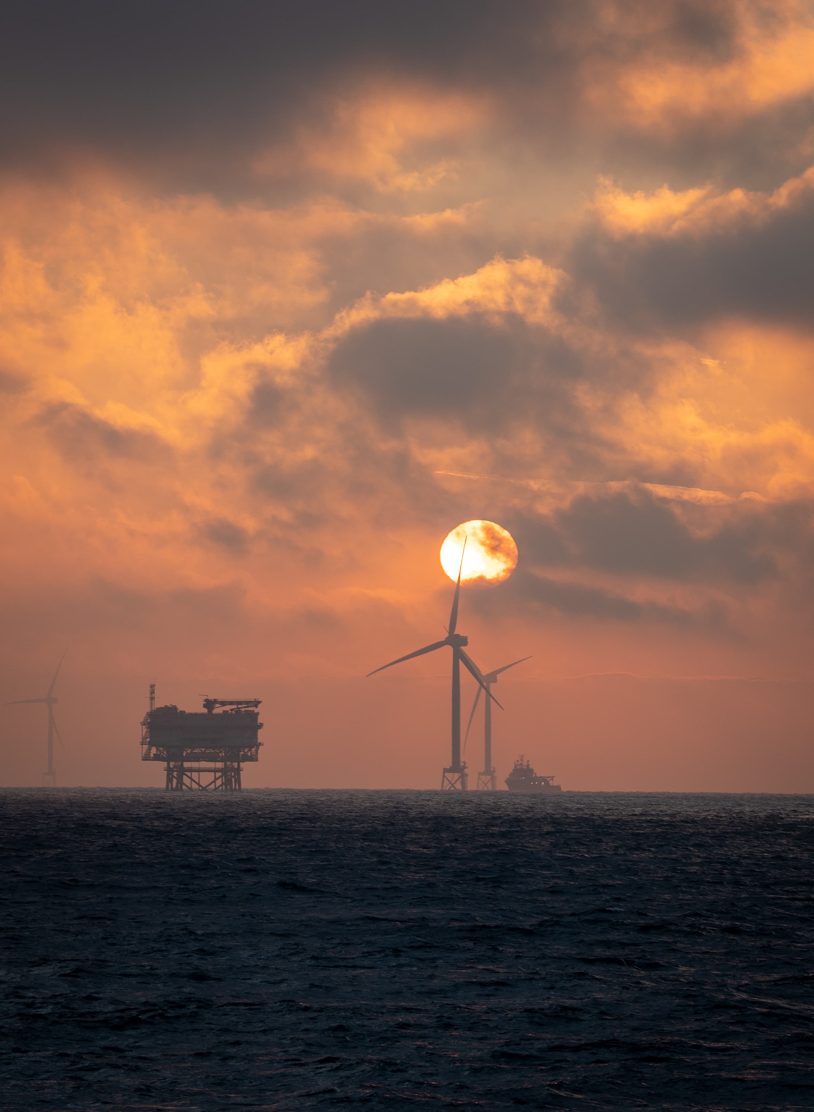 Offshore platform operations and project management at sunset